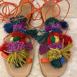 Strappy lace up leather sandals with multi-colored Pom Pom and tassel details